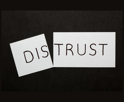 'Distrust' written on paper
